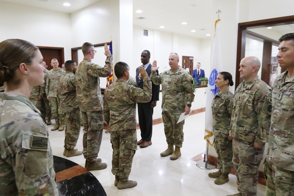 Task Force Liberty Soldiers promote, re-enlist at Qatar embassy ceremony
