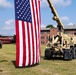 Military vehicles from the 94th Training Division hoist the American flag for the Change of Command Ceremony