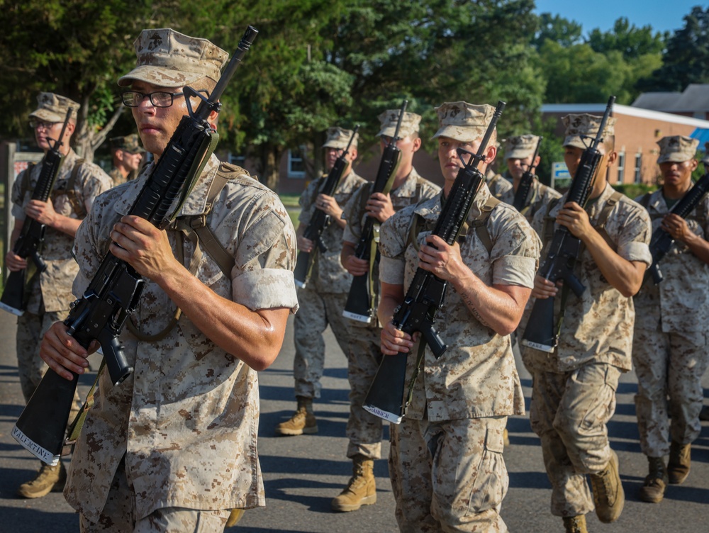 Candidates with Officer Candidate School practice close order drill at the Parade Deck on Marine Corps Base Quantico