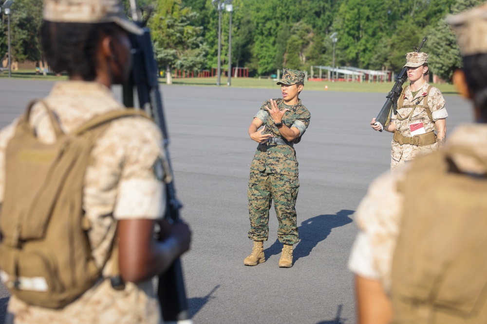Candidates with Officer Candidate School practice close order drill at the Parade Deck on Marine Corps Base Quantico