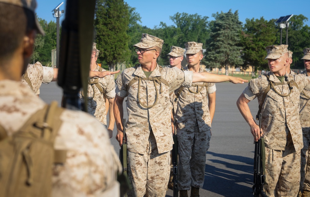 Candidates with Officer Candidate School practice close order drill at the Parade Deck on Marine Corps Base Quantico