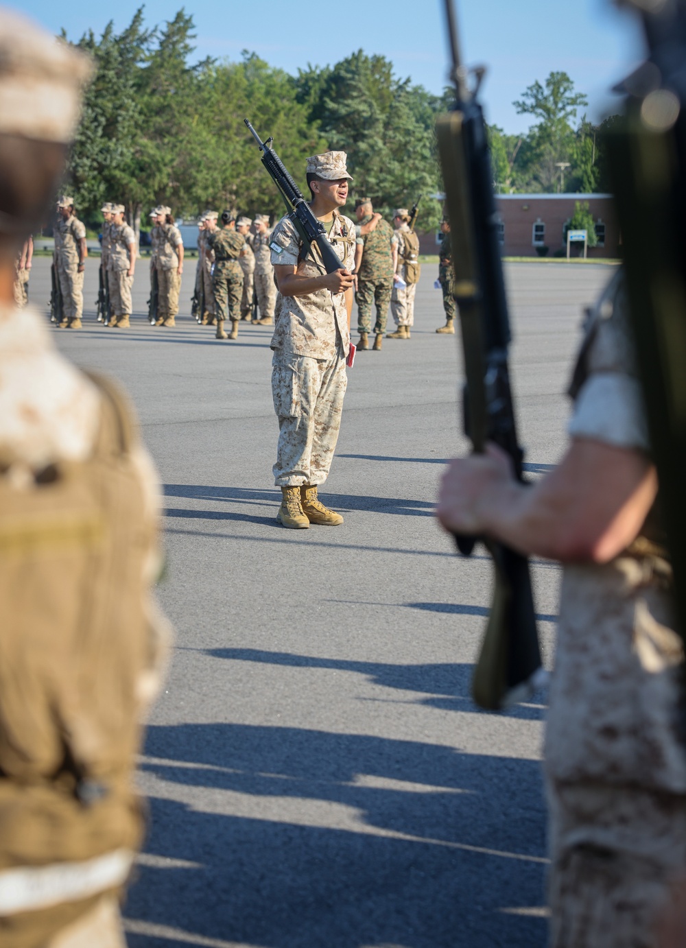 Candidates with Officer Candidate School practice close order drill at the Parade Deck on Marine Corps Base Quantico