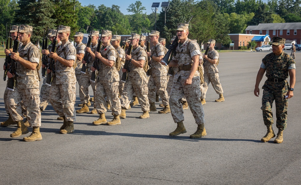 Candidates with Officer Candidate School practice close order drill at the Parade Deck on Marine Corps Base Quantico