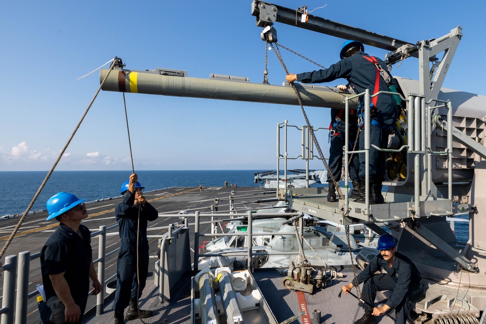 USS Bataan Sailors load ammo