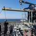 USS Bataan Sailors load ammo