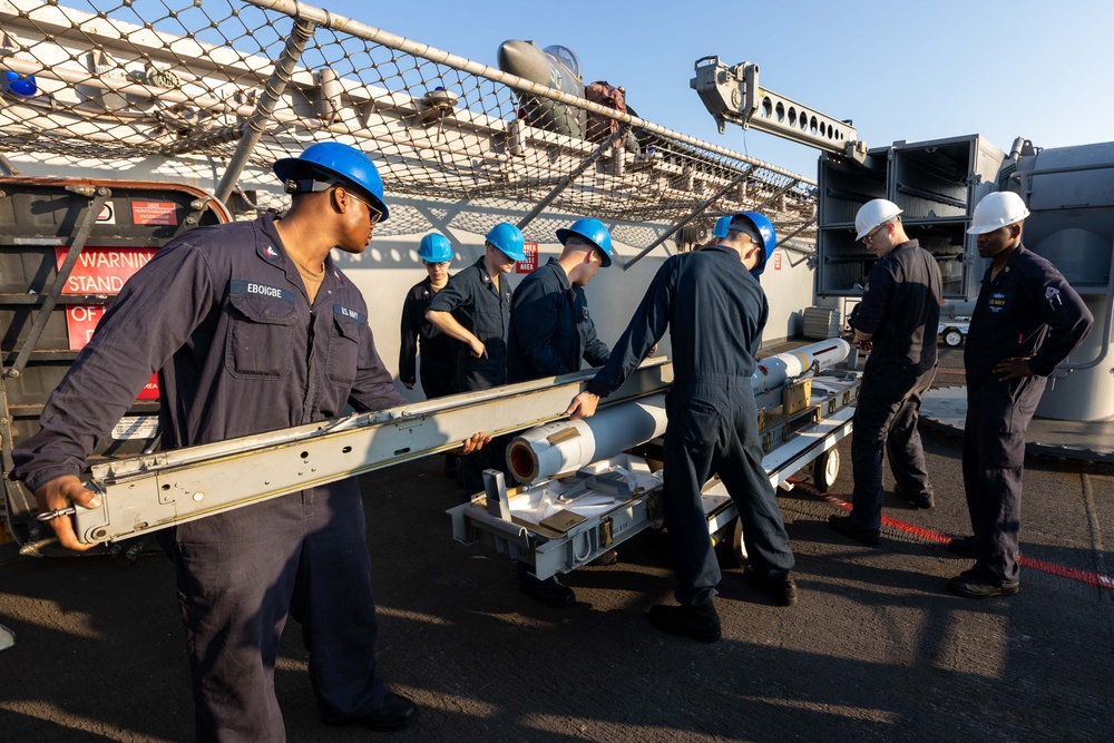 USS Bataan Sailors load ammo