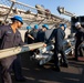 USS Bataan Sailors load ammo