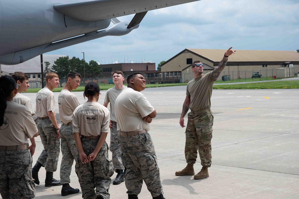 KC-135 Crew Chief shows New York State Civil Air Patrol cadets exterior of aircraft