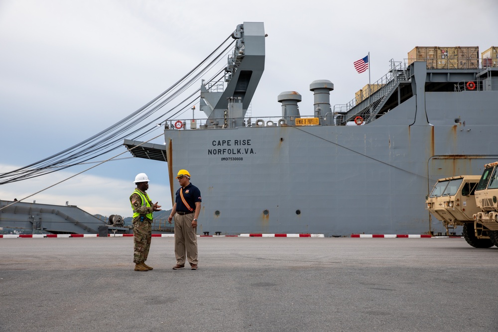 U.S. Army Command Sgt. Maj. Samuel Samedy gives a status report to U.S. Army Command Sgt. Maj. Freddy Trejo on port operations for Exercise Hanuman Guardian 2023