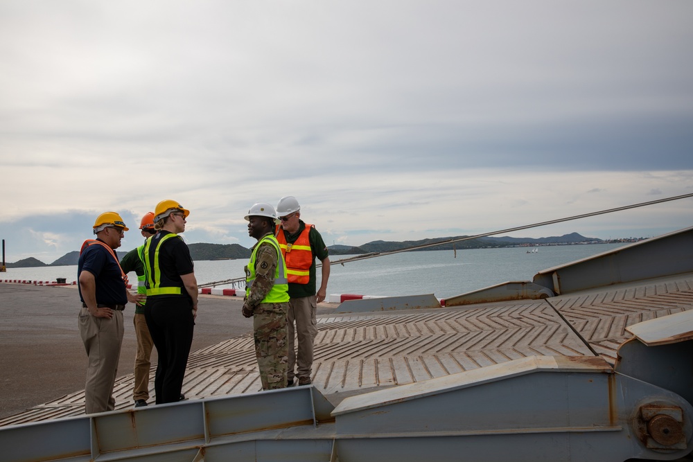 U.S. Army Col. Mary Martinez, exercise director for Hanuman Guardian 2023, receives mission reports from operations leadership during a site visit at the Port of Sattahip