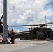 A Royal Thai Army Soldier stands guard over a U.S. Army UH-60 Black Hawk