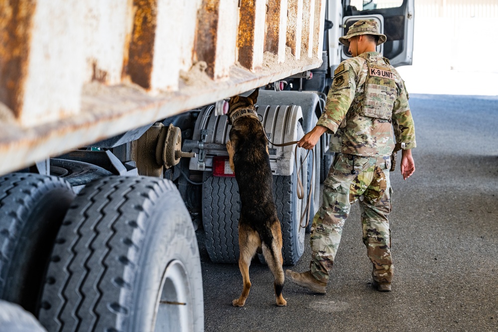 Military Working Dog Team Inspects and Protects