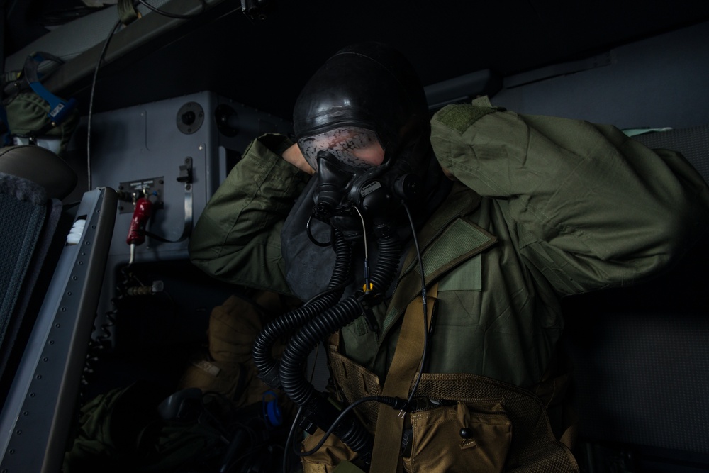 Marine Aerial Refueler Transport Squadron (VMGR) 252 trains with mission-oriented protective posture gear in a KC-130J Super Hercules