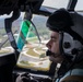 Marine Aerial Refueler Transport Squadron (VMGR) 252 trains with mission-oriented protective posture gear in a KC-130J Super Hercules