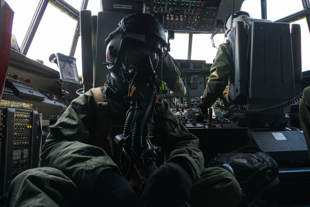 Marine Aerial Refueler Transport Squadron (VMGR) 252 trains with mission-oriented protective posture gear in a KC-130J Super Hercules