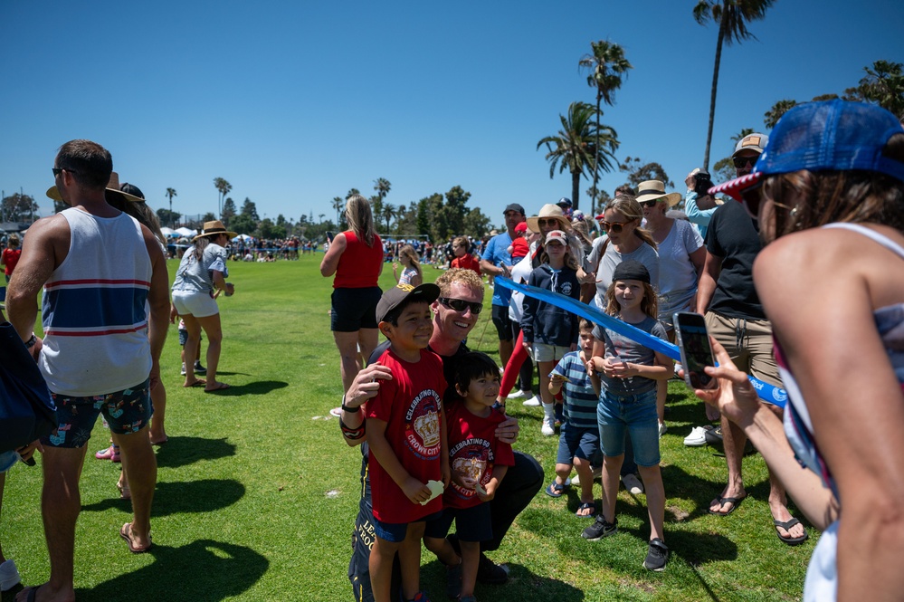 Navy parachute team, the &quot;Leap Frogs,&quot; jump into Coronado Island for 4th of July