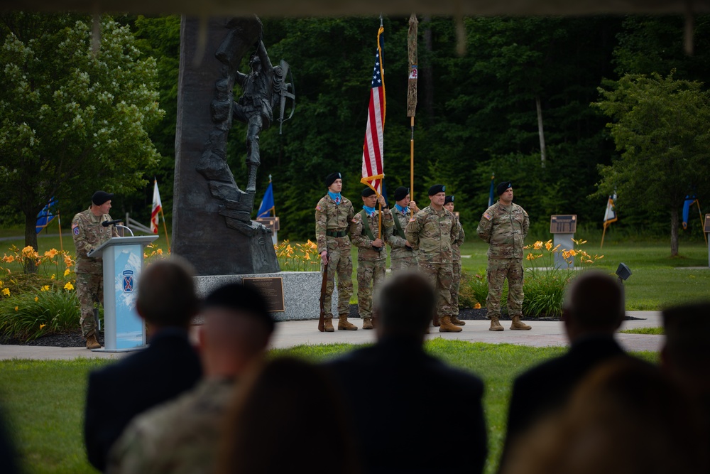 Command Sgt. Maj. Christopher Donaldson, the 2nd Brigade Combat Team command sergeant major, and Col. Scott Wence, the 2nd BCT commander, case the brigade colors on Fort Drum