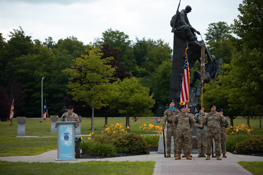 Command Sgt. Maj. Christopher Donaldson, the 2nd Brigade Combat Team command sergeant major, and Col. Scott Wence, the 2nd BCT commander, case the brigade colors on Fort Drum