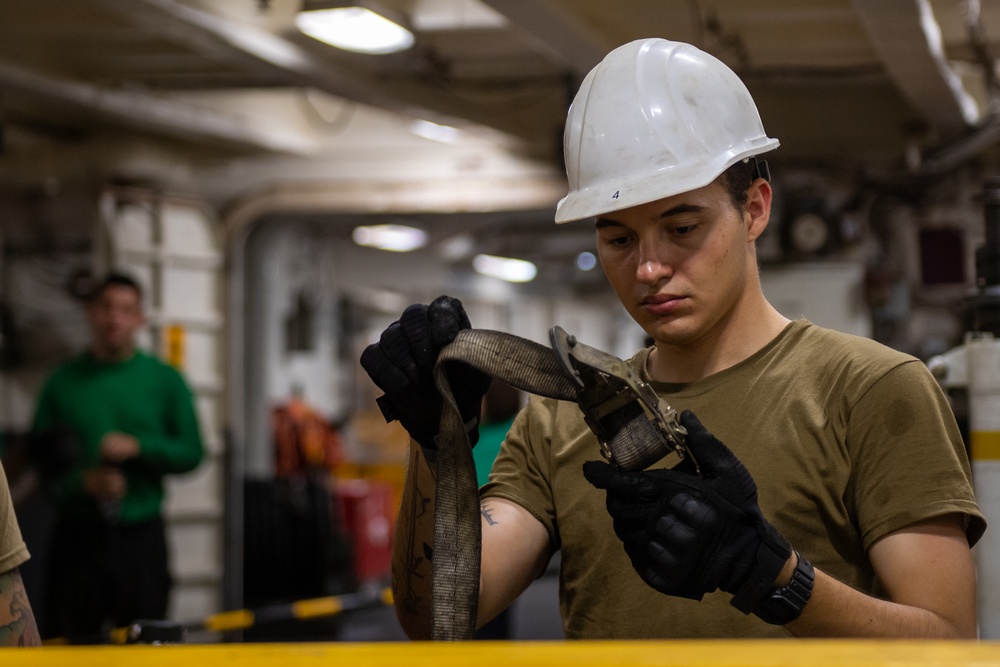 USS Ronald Reagan (CVN 76) Sailors change an engine
