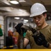 USS Ronald Reagan (CVN 76) Sailors change an engine
