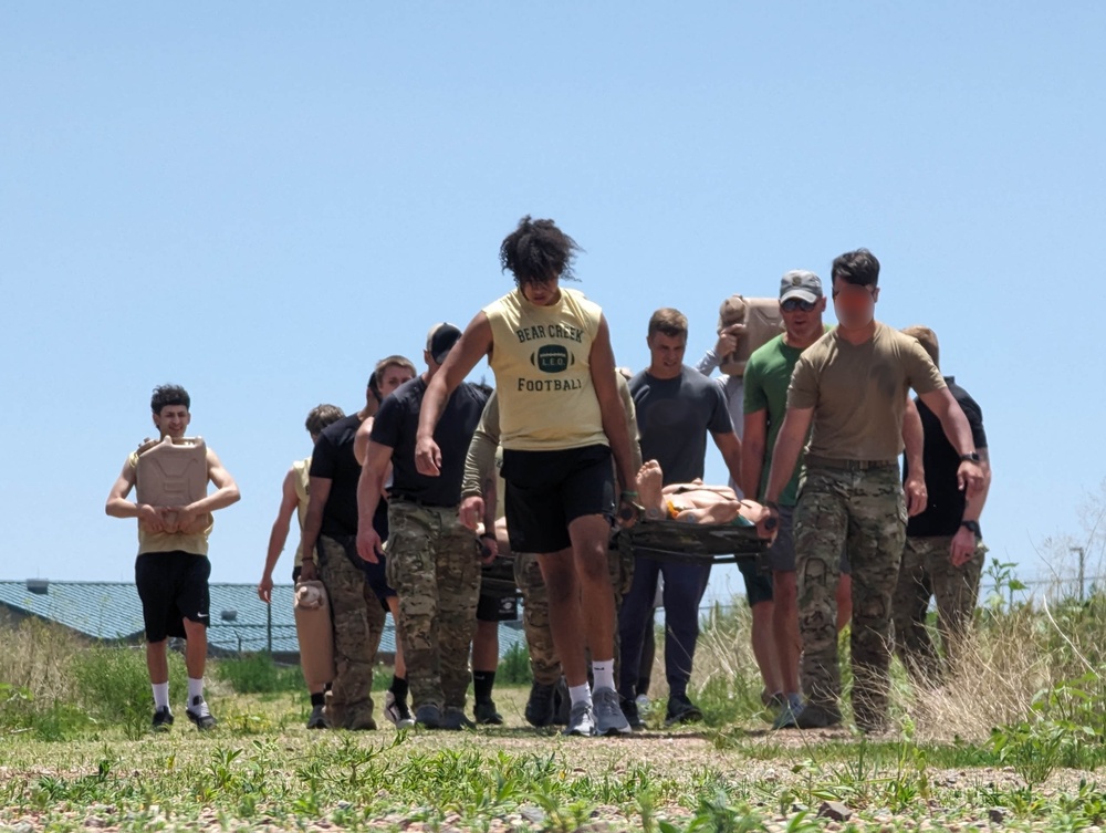 Bear Creek Highschool football team works out with 10th Special Forces Group