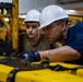 USS Ronald Reagan (CVN 76) Sailors change an engine