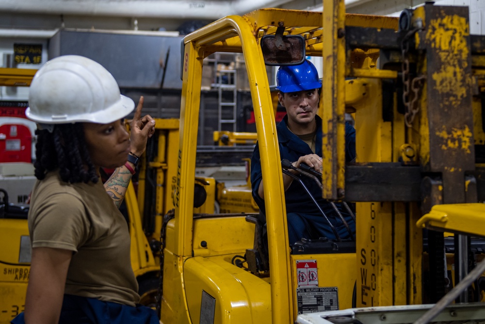 USS Ronald Reagan (CVN 76) Sailors change an engine
