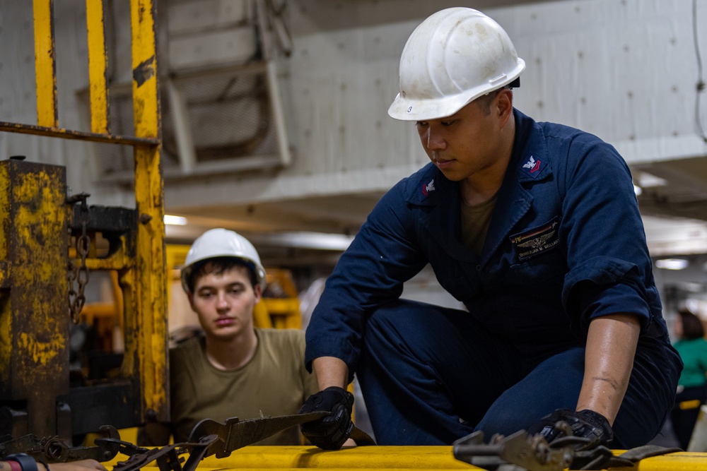 USS Ronald Reagan (CVN 76) Sailors change an engine