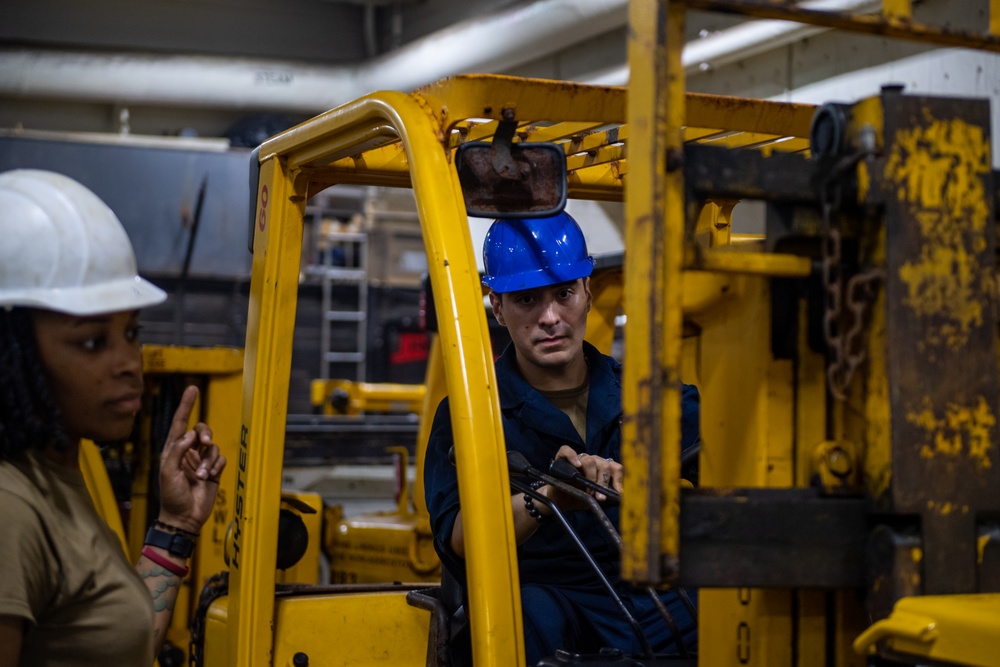 USS Ronald Reagan (CVN 76) Sailors change an engine