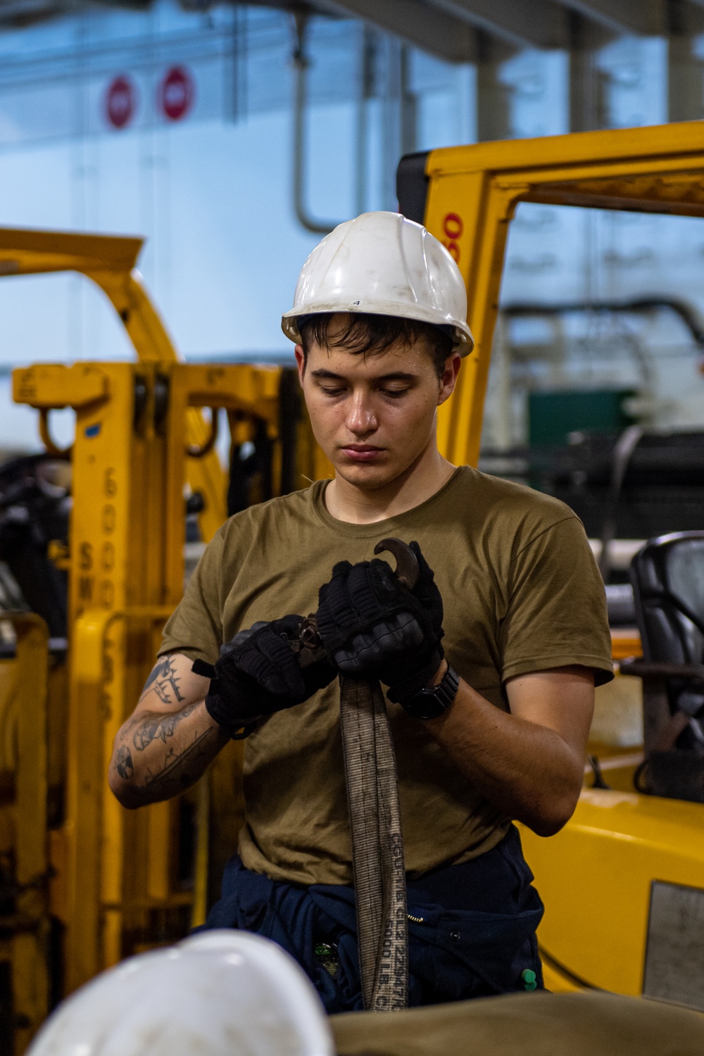 USS Ronald Reagan (CVN 76) Sailors change an engine