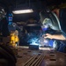 USS Ronald Reagan (CVN 76) Sailors train midshipmen how to weld and use a lathe