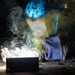 USS Ronald Reagan (CVN 76) Sailors train midshipmen how to weld and use a lathe