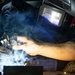USS Ronald Reagan (CVN 76) Sailors train midshipmen how to weld and use a lathe
