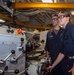USS Ronald Reagan (CVN 76) Sailors train midshipmen how to weld and use a lathe