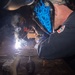 USS Ronald Reagan (CVN 76) Sailors train midshipmen how to weld and use a lathe