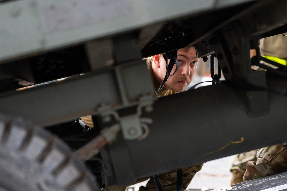 Yokota AB, Travis AFB Airmen load cargo onto C-17 Globemaster III in support of MG23