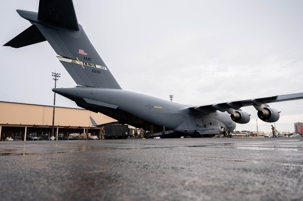 Yokota AB, Travis AFB Airmen load cargo onto C-17 Globemaster III in support of MG23