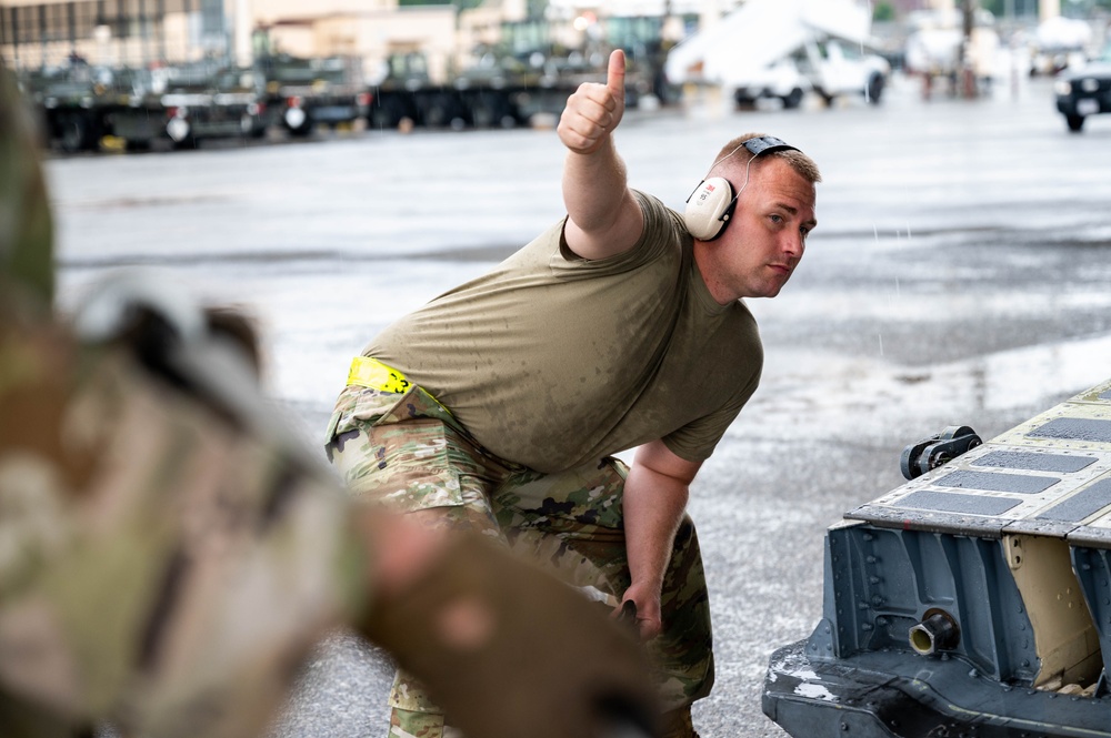 Yokota AB, Travis AFB Airmen load cargo onto C-17 Globemaster III in support of MG23