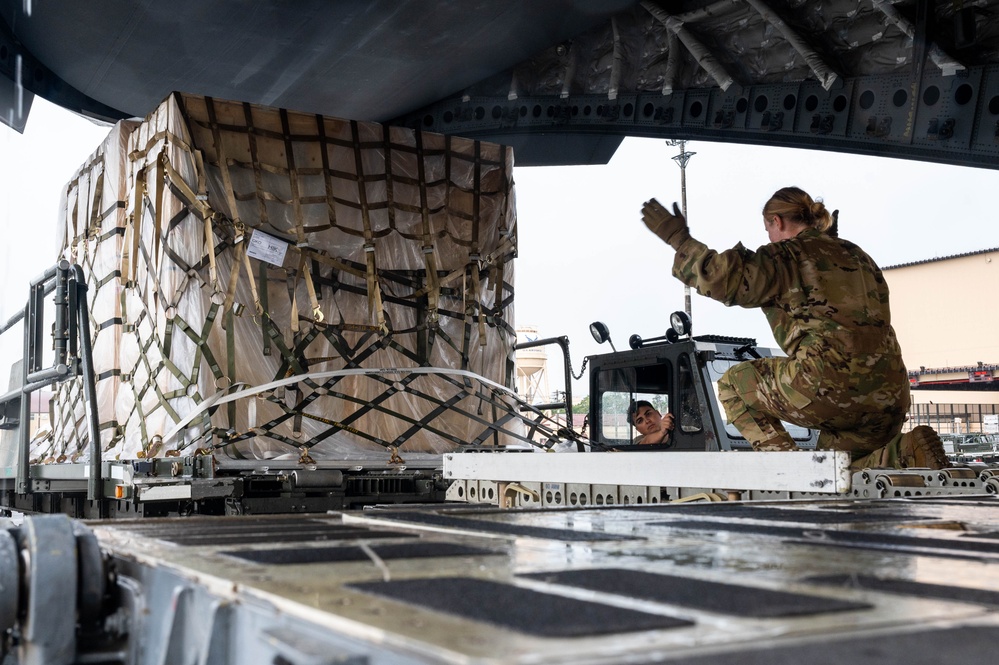 Yokota AB, Travis AFB Airmen load cargo onto C-17 Globemaster III in support of MG23