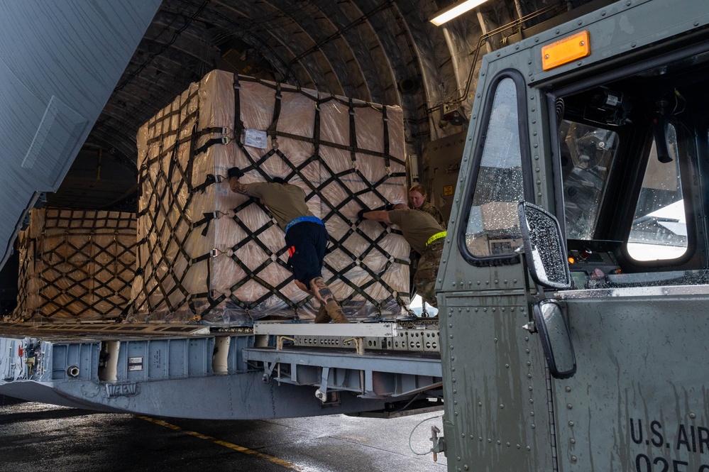 Yokota AB, Travis AFB Airmen load cargo onto C-17 Globemaster III in support of MG23