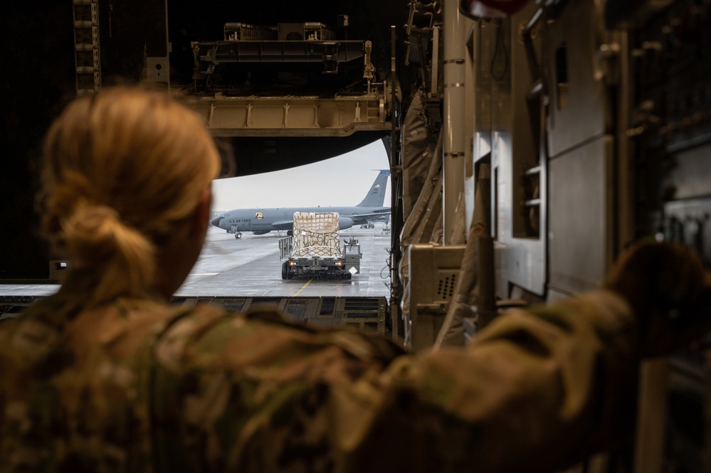 Yokota AB, Travis AFB Airmen load cargo onto C-17 Globemaster III in support of MG23