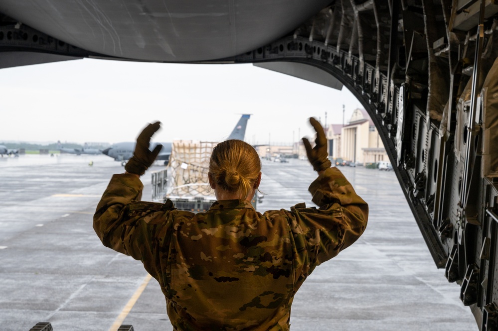 Yokota AB, Travis AFB Airmen load cargo onto C-17 Globemaster III in support of MG23