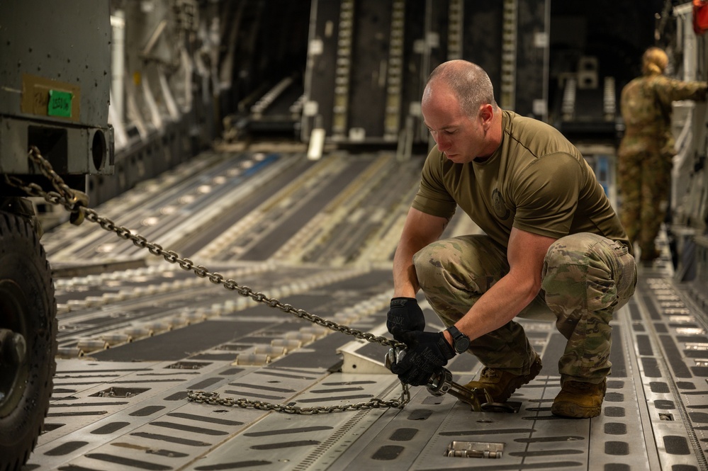 Yokota AB, Travis AFB Airmen load cargo onto C-17 Globemaster III in support of MG23