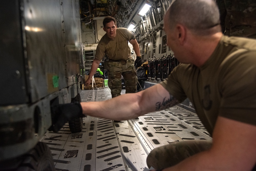 Yokota AB, Travis AFB Airmen load cargo onto C-17 Globemaster III in support of MG23