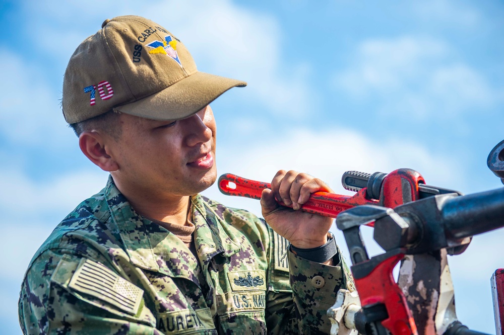 Sailor Performs Maintenance aboard USS Carl Vinson (CVN70)