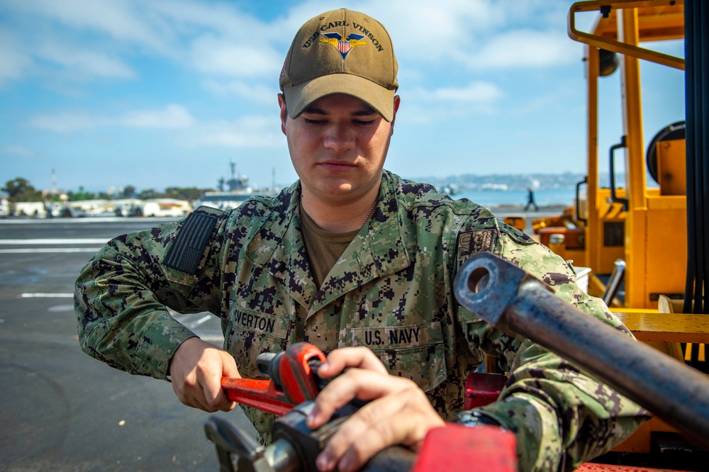 Sailor Performs Maintenance aboard USS Carl Vinson (CVN70)