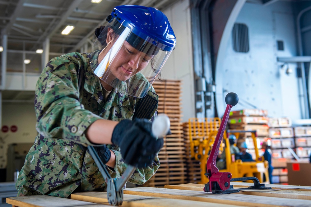 Sailor Bands Pallets in the Hangar Bay aboard USS Carl Vinson (CVN70)