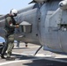 Pilot Checks His Helicopter
