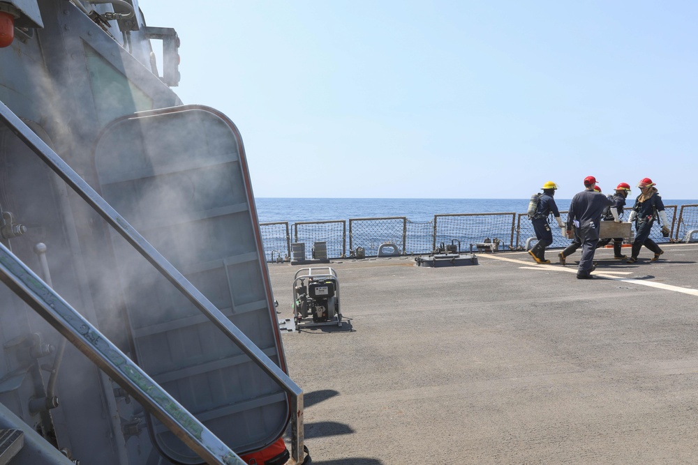 Sailors Move Equipment During Drill