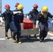 Sailors Practice Moving Firefighting Equipment